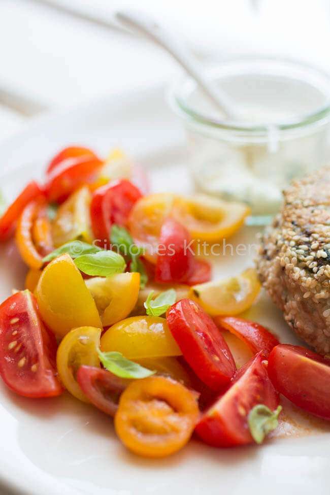 Chicken burger with tomato salad