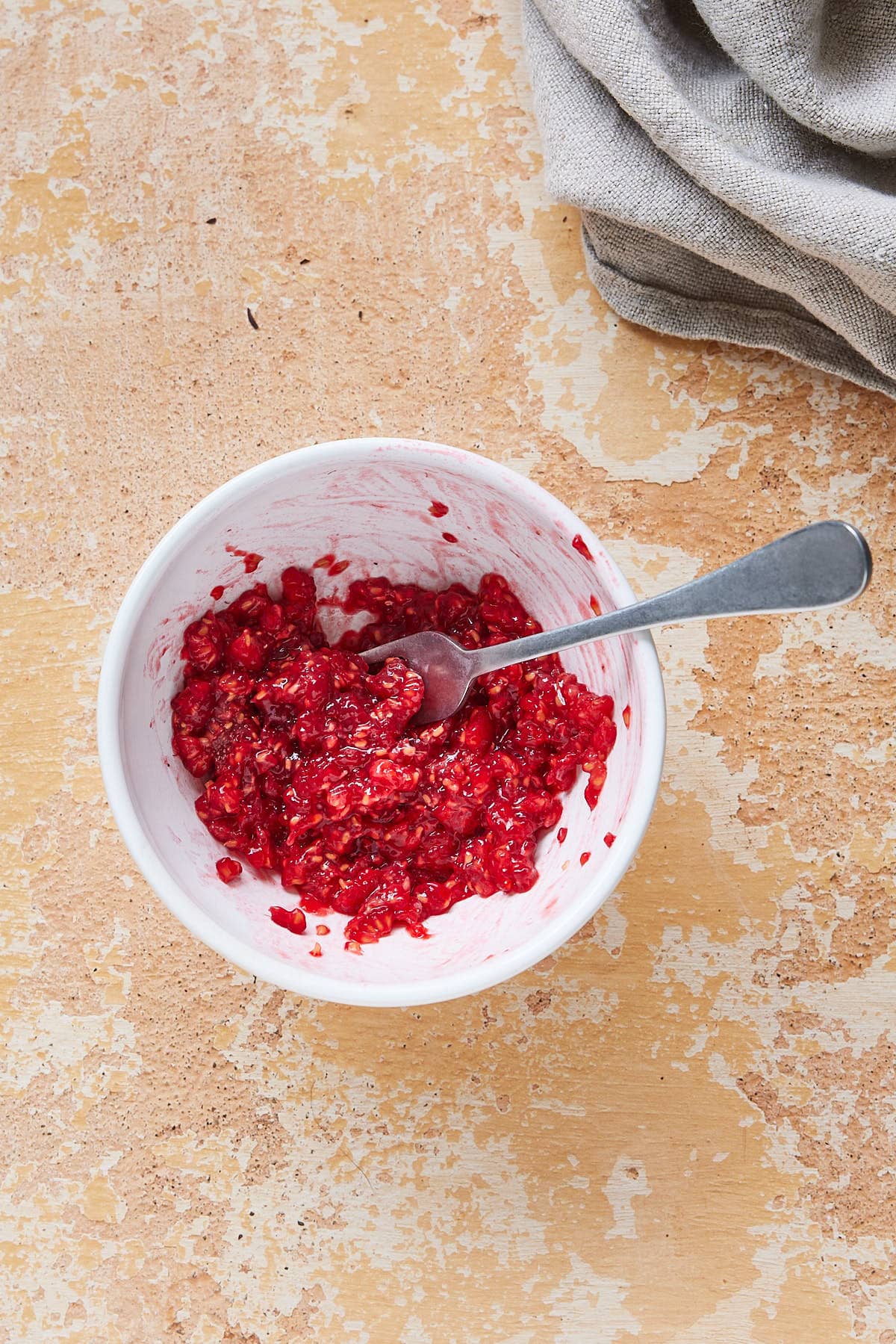 Crush the raspberries