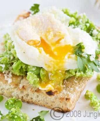 Broad beans on toast with poached egg and parmesan