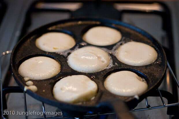 Aebleskiver pan with the batter in it