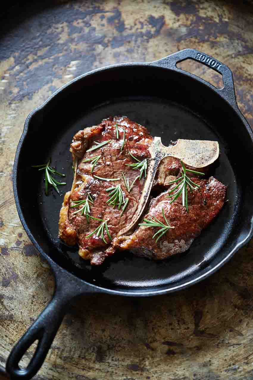 T-bone steak in a cast iron pan