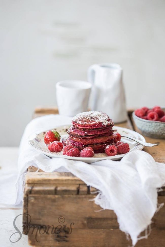 Stack of beetroot pancakes on a wooden crate