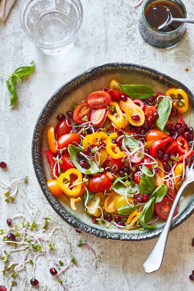 Tomato salad with bell peppers and pomegranate