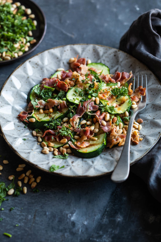 Roasted courgette salad with bacon and pinenuts