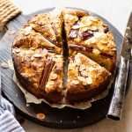 rhubarb cake sliced in pieces on wooden board