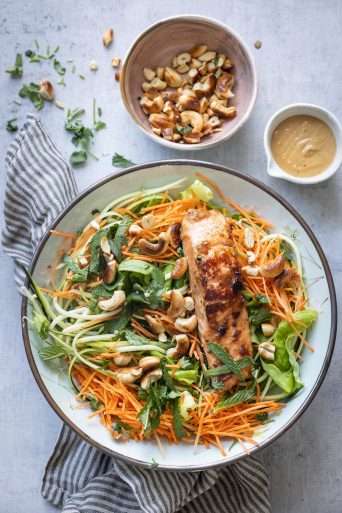 Asian salad with salmon and cashew dressing