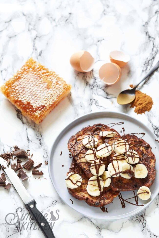 Raisin bread french toast with honey, banana and chocolate
