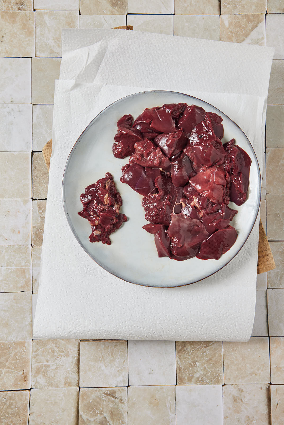 Plate with raw chicken livers