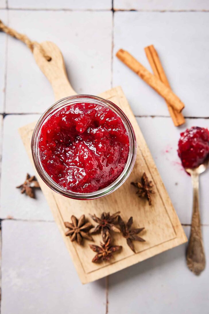 Cranberry compote with star anise on a little wooden board