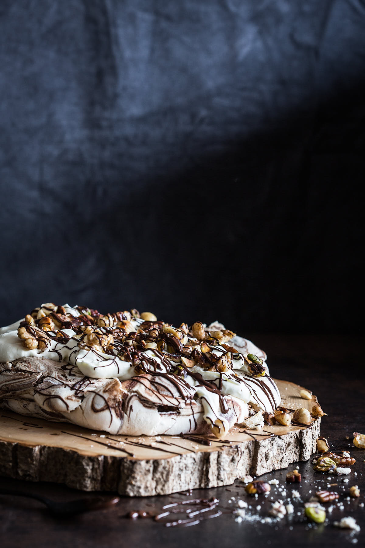 Chocolate pavlova on a wooden serving board