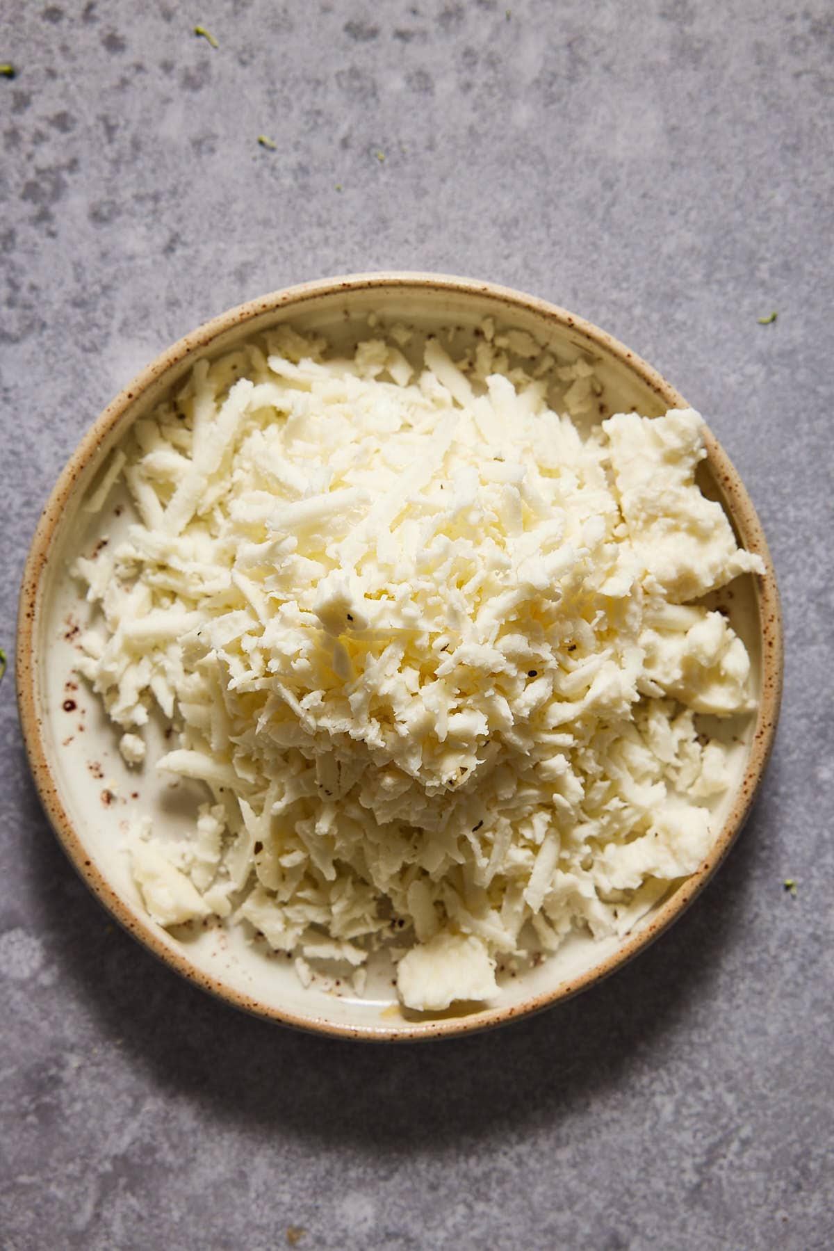 Grated halloumi on a small plate