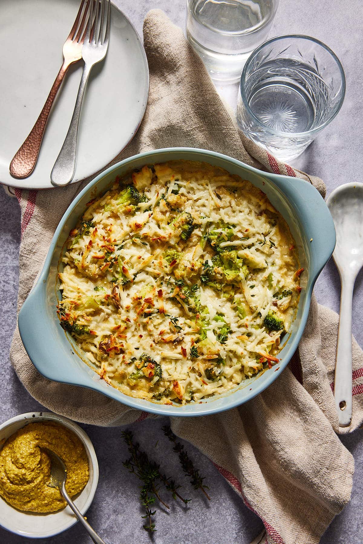 Broccoli cheese casserole on a table ready to be eaten