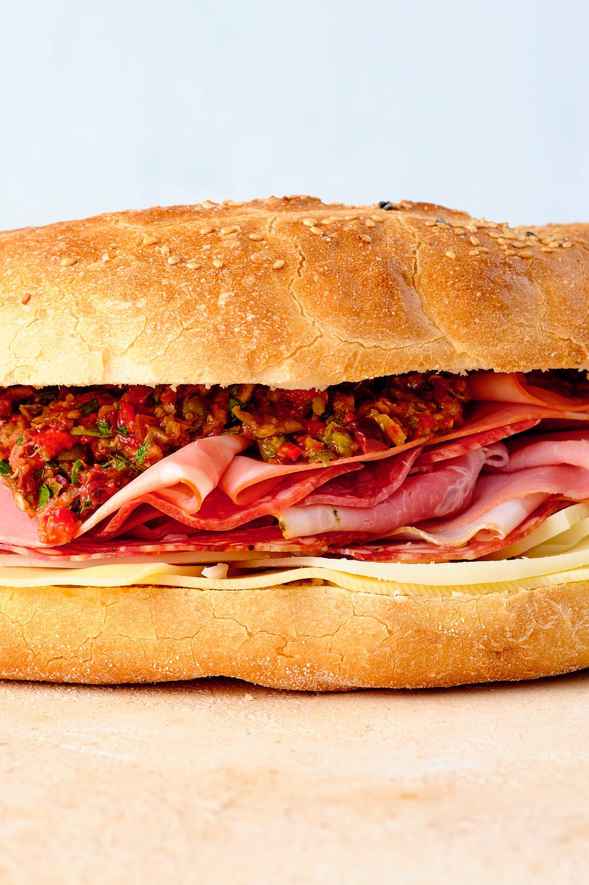 Assemble the muffuletta sandwich