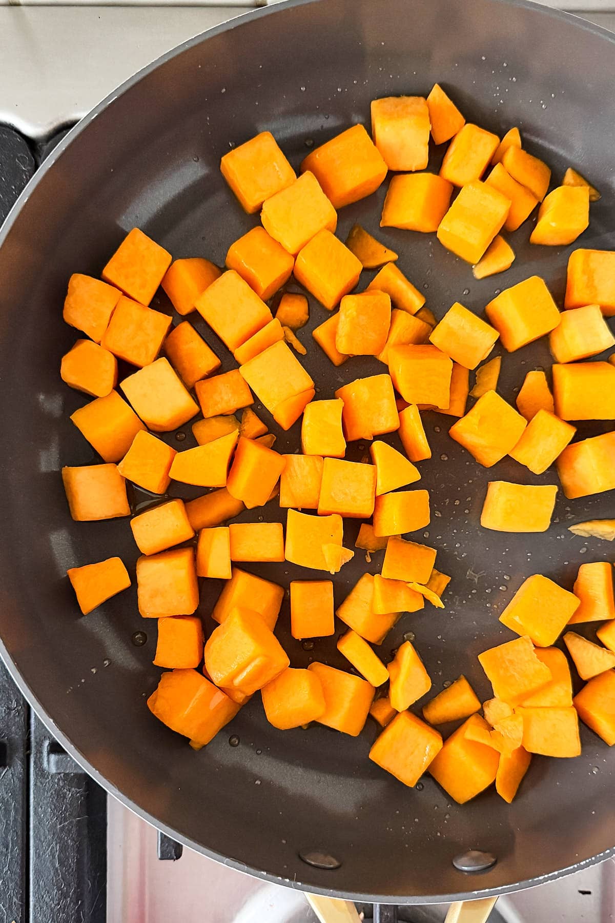 Start by adding the pumpkin to the pan