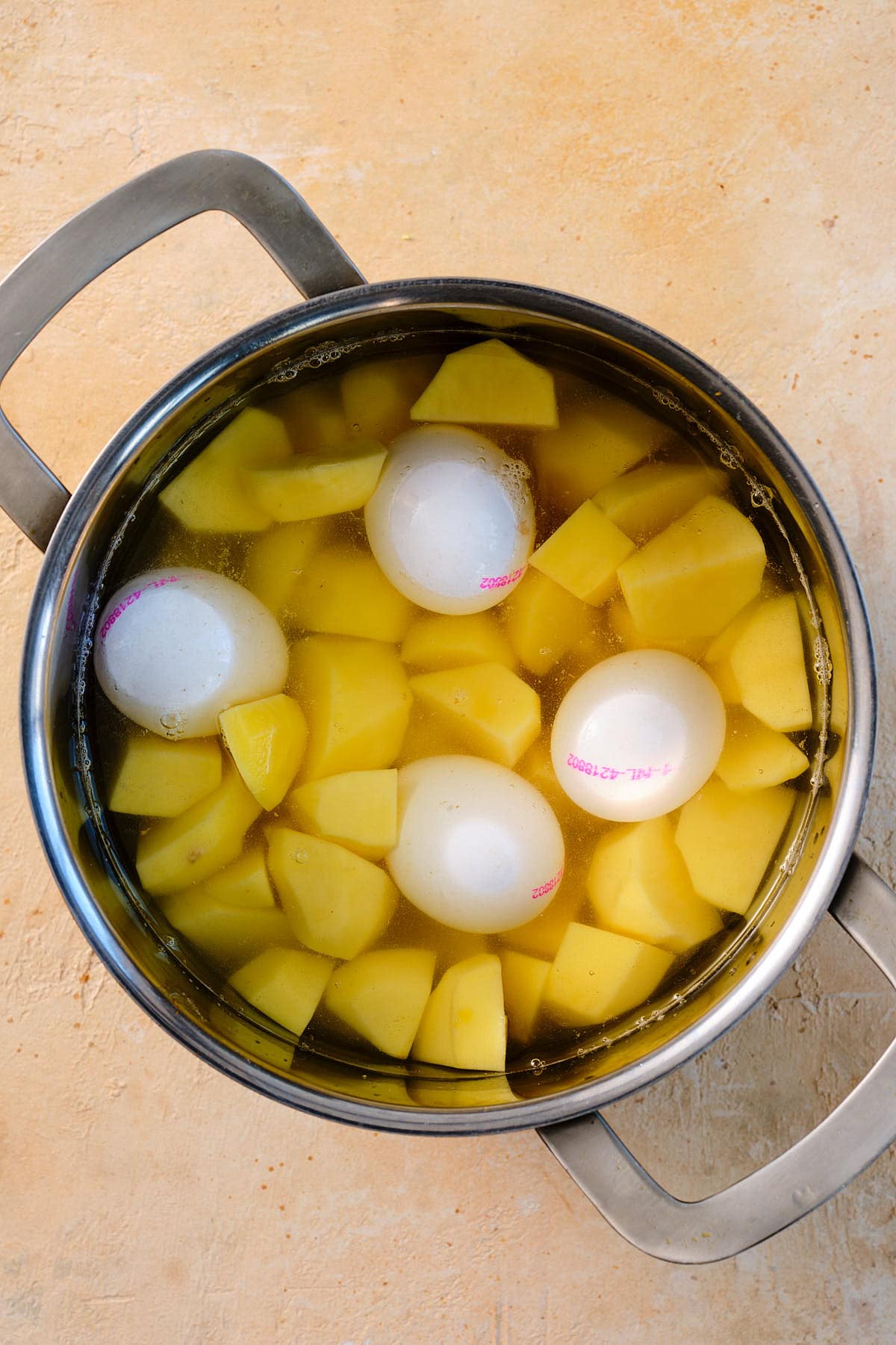Cook the potatoes with the eggs